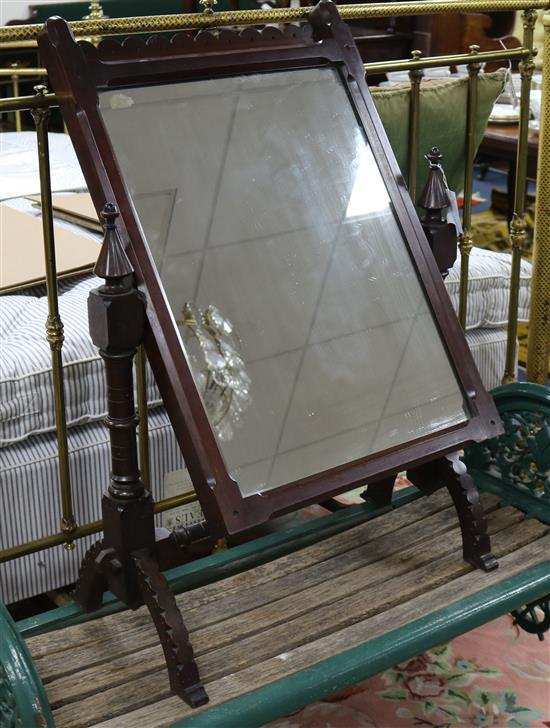 After A.W.N. Pugin - a Victorian Gothic revival carved mahogany swing frame toilet mirror W.63cm, H.92cm